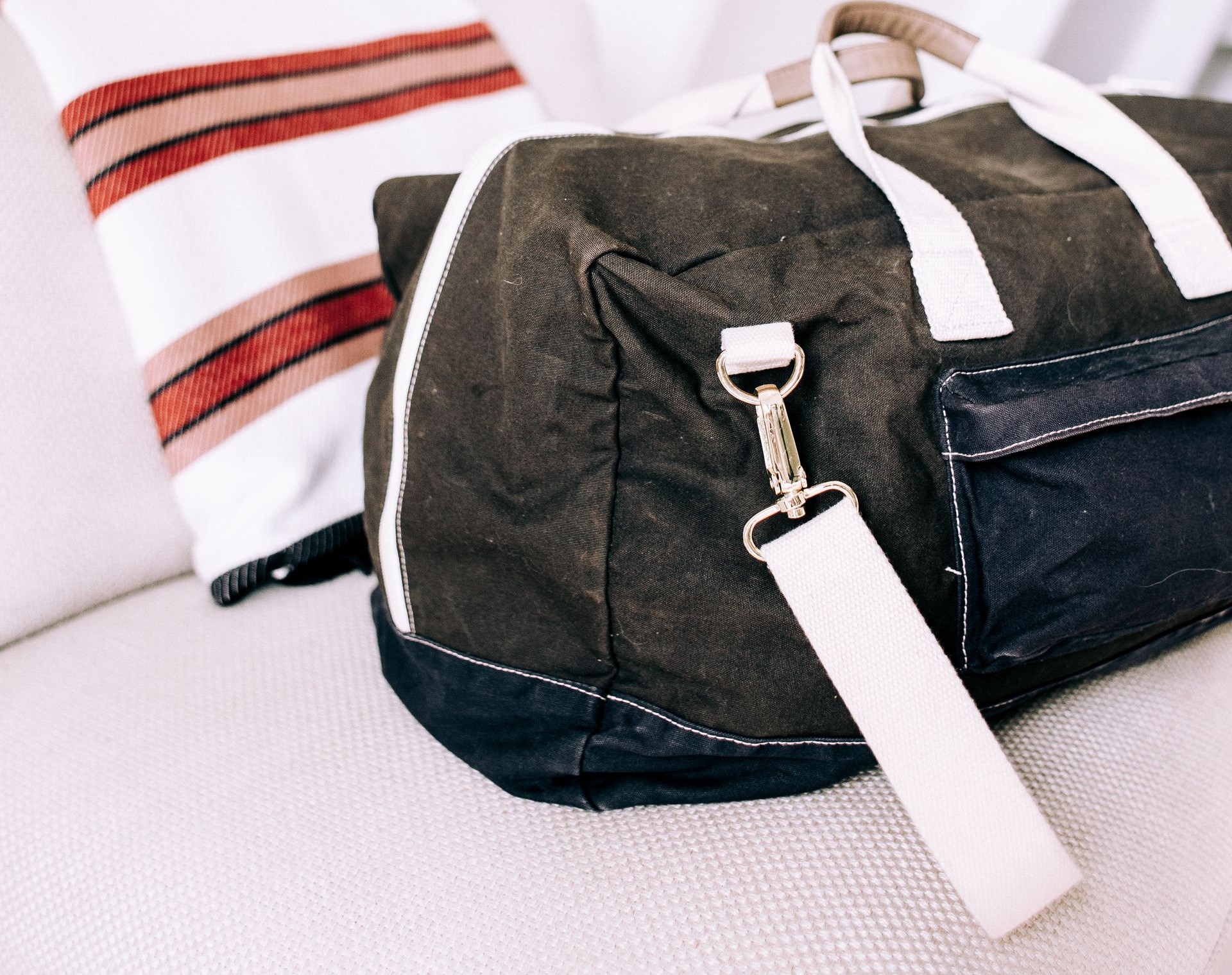Waxed canvas gym duffel bag with webbing straps